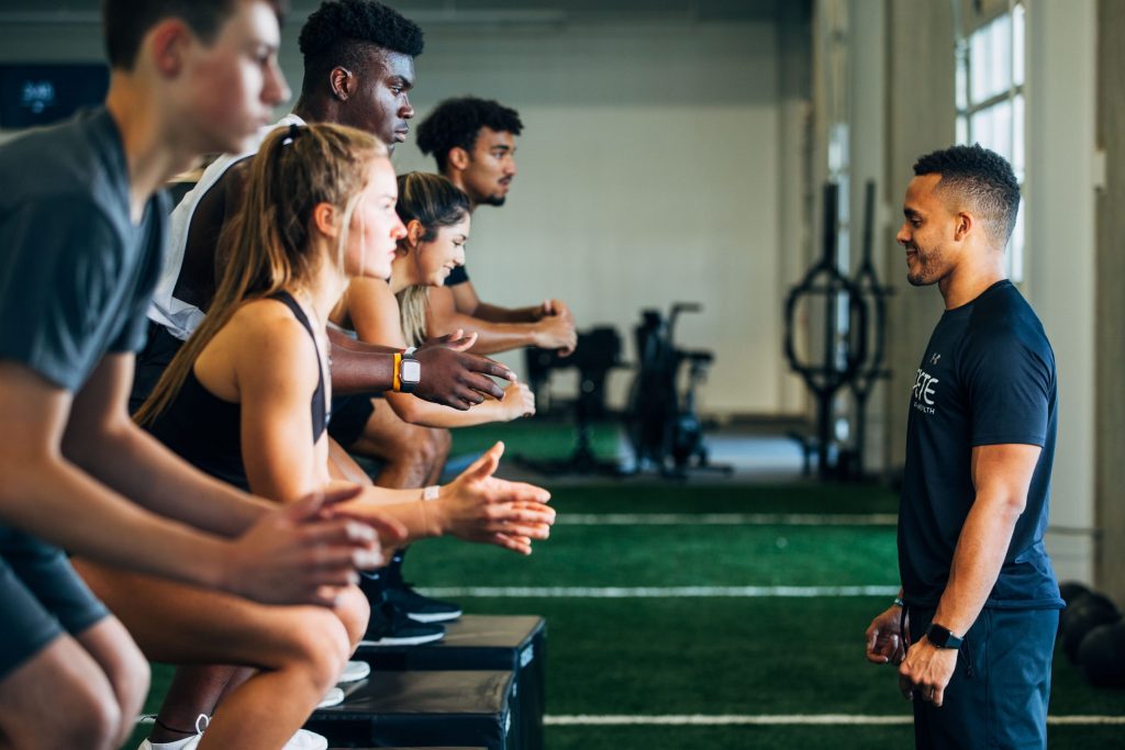 YMCA fitness group exercising with an instructor