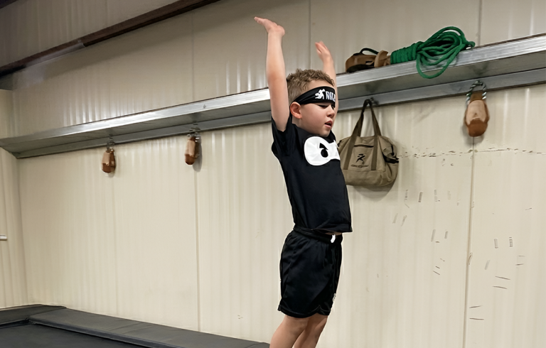 Young Lil Ninja participant practicing a movement challenge