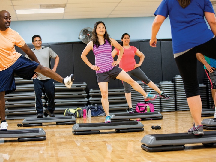 Participants in a group step fitness class