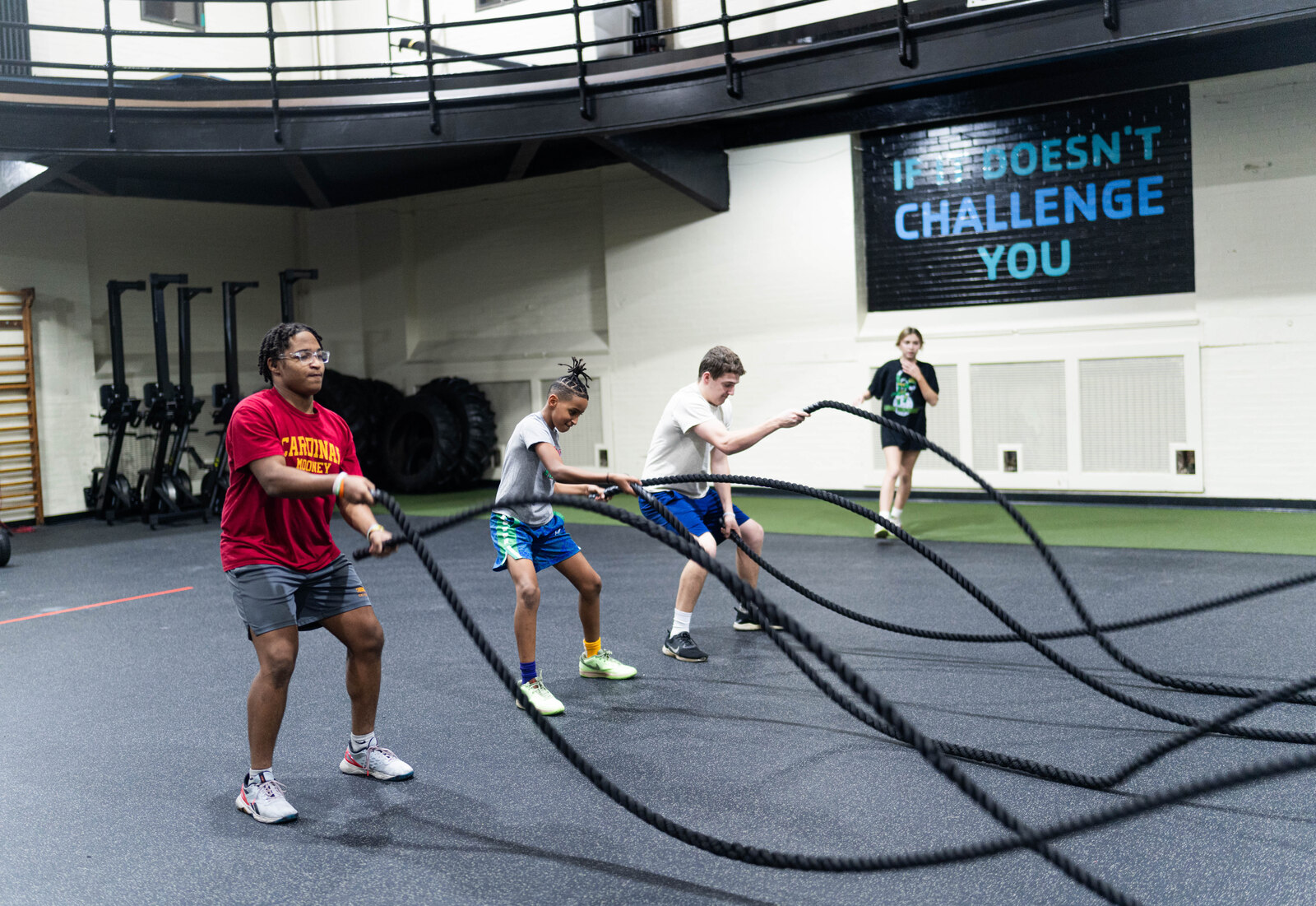 Athletes working with battle ropes at the Athletic Performance Center