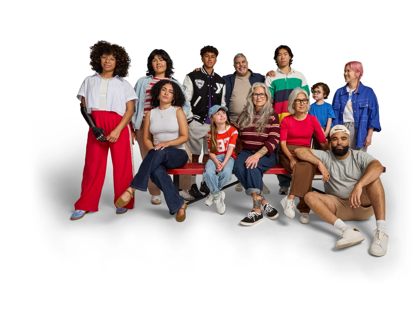 A multigenerational group of YMCA community members standing and sitting together